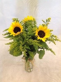 Sunflowers with glass vase
